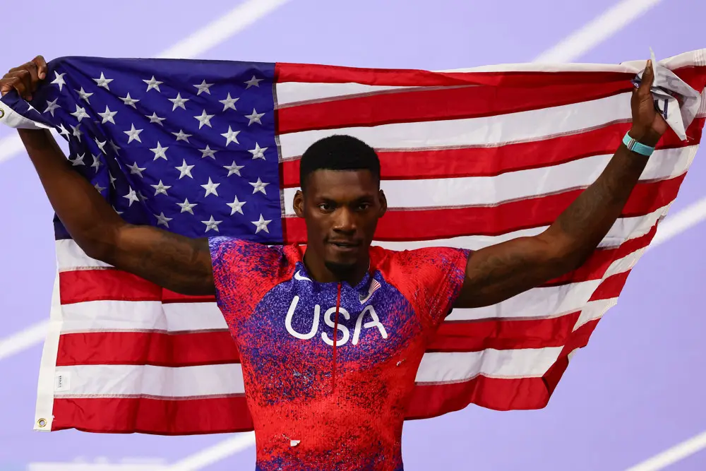 Fred Kerley with the American Flag