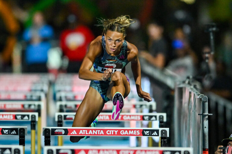 Anna Hall of the United States runs the hurdles